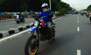 A professional motorcyclist riding on a track. 