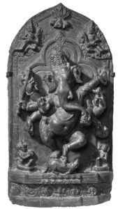 a relief of a dancing ganesha, a figure with an elephant head and six arms