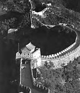 aerial photograph of the great wall, which shows the wall winding down the mountainside