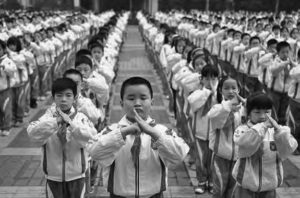 photo of young students in rows practicing moves