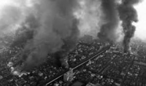 aerial photo of a burning city