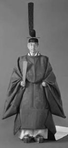 photo of a man in robes and a very tall hat