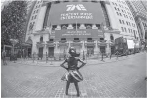 photo of a defiant girl statue in front of a tencent music entertainment building